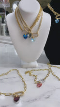 Load and play video in Gallery viewer, gold plated curb chain with pave clasp and swarovski heart pendant in blue,pink, gold, and black color
